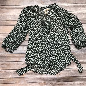 Sheer black blouse with heart detail